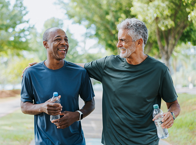 A person is working at a computer in a busy office.