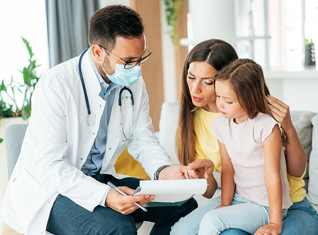 Pediatrician Examining A Child Covered By An IBX Health Plan