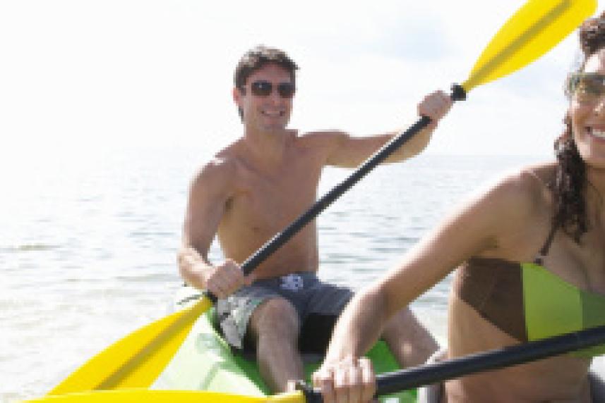 Photo: Man and woman kayaking