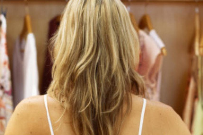 Photo: Woman looking into a closet