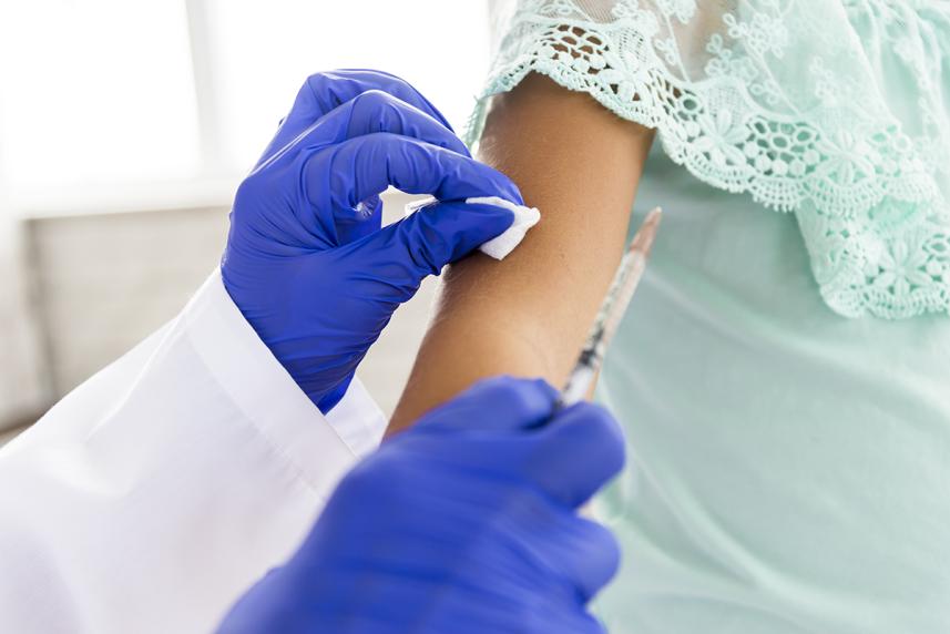 Child receiving injection at the doctor