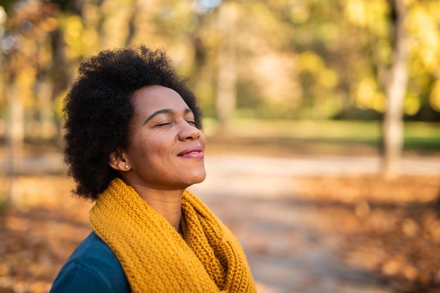 Woman smiling in the fall