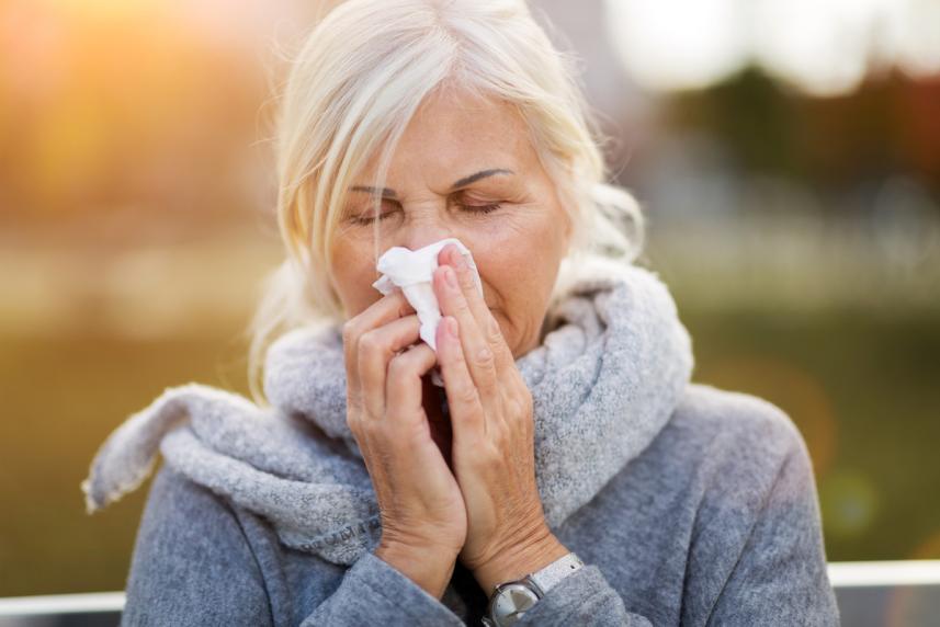 woman sneezing