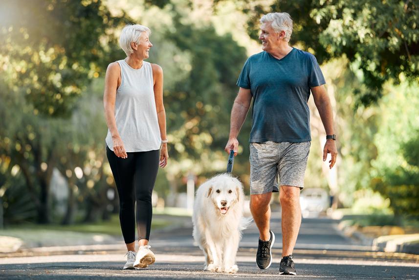 Couple walking their dog