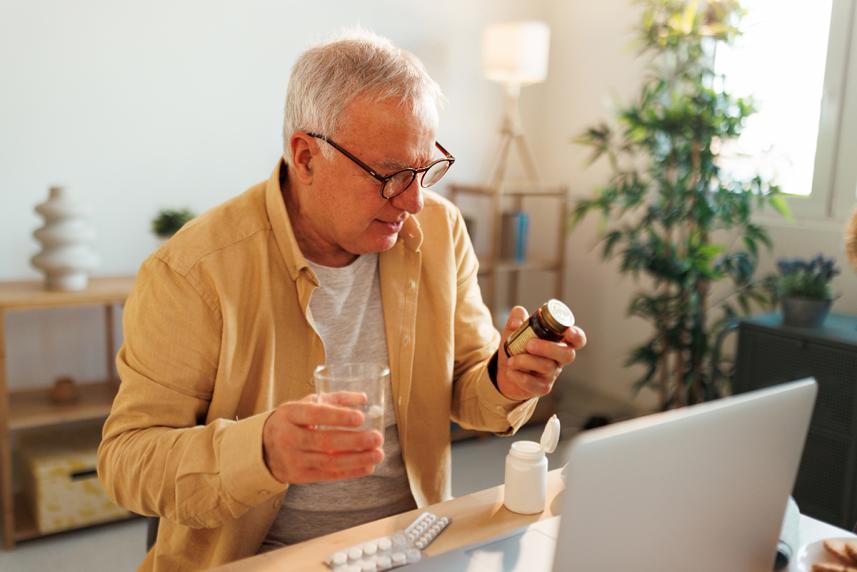 Person comparing pills