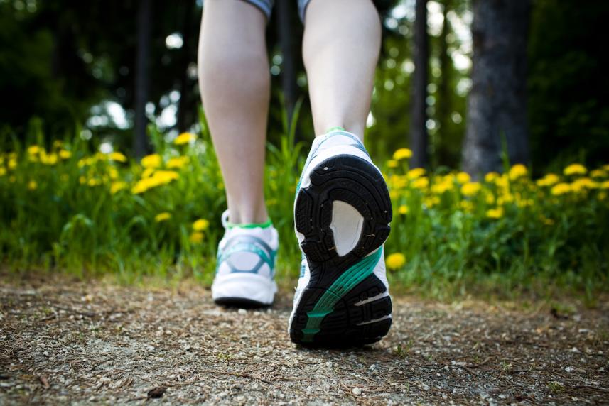 Photo: Close-up view of person's sneakered feet, walking