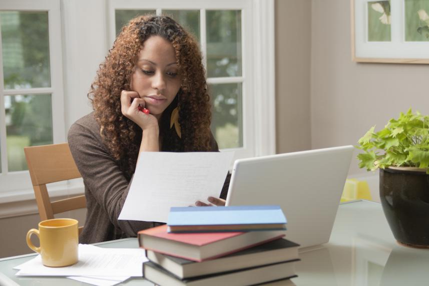 reading next to the laptop