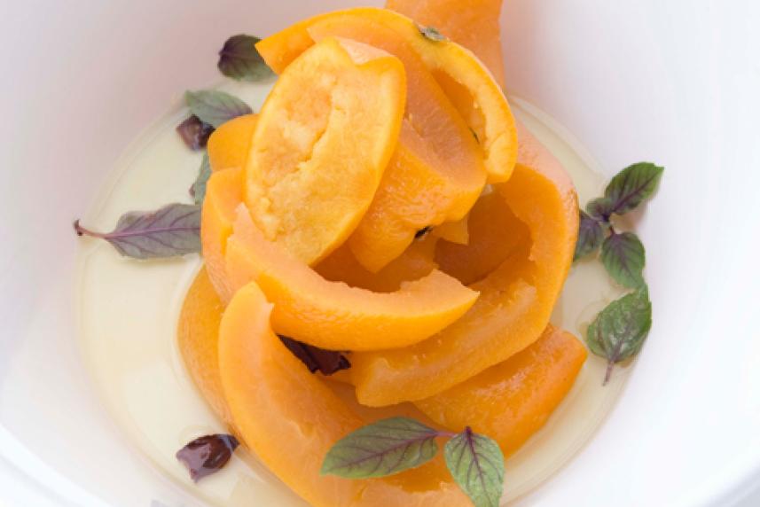 Photo: Bowl of candied fruit peel with green garnish