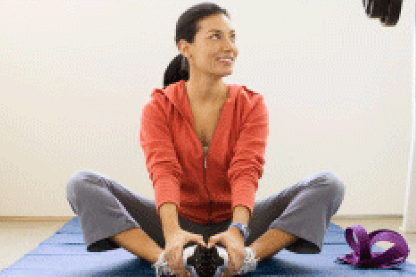 Photo: Woman stretching on yoga mat