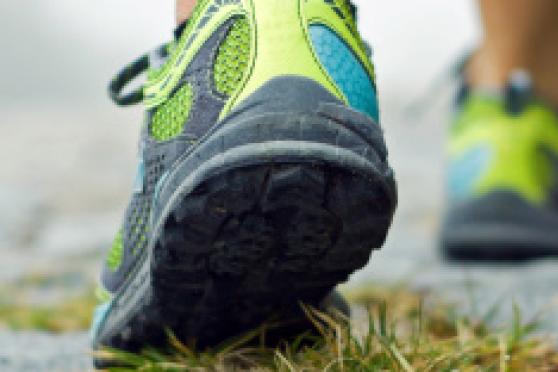 Photo: Close-up of athletic sneakers on pavement