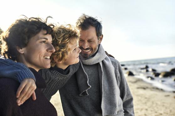 Family hanging out together near the shore