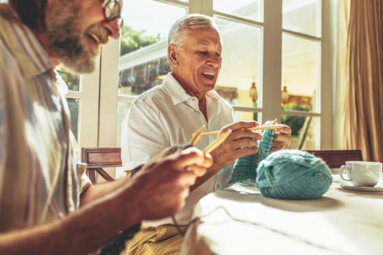 older couple playing with clay