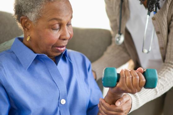 Photo: Senior woman doing arm workouts