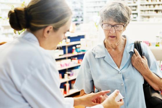 Photo: pharmacist explaining medication to customer