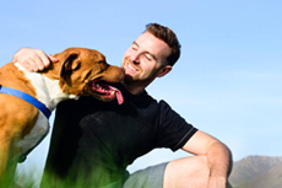 Owner and dog in park