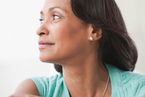 Photo: Woman staring over right shoulder pondering