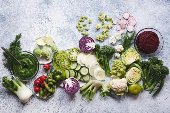 Photo: A setting of colorful, nutrient-rich vegetables: tender-stem broccoli, Romanesco broccoli, green and red cabbages, radishes, edamame, brussels sprouts, cauliflower, fennel.