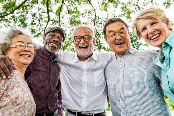 Photo: A group of friends smiling at camera.