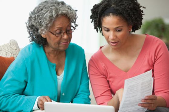 Two women read paprwork