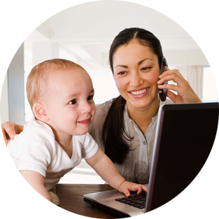 woman with baby on computer